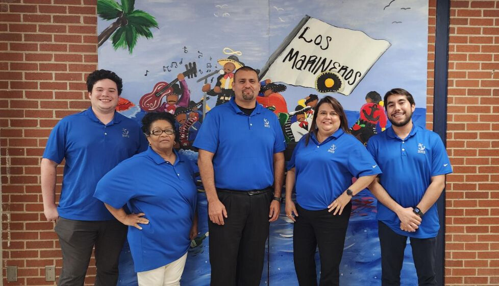 BMS administration in front of a student painted mural. From left to right, Michael Hartsfield, Noalie Watson, Larry de la Cruz, Lydia Gonzalez, Octavio Angel.